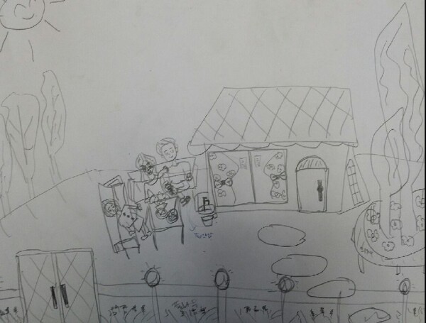 ▲진숙씨는 한적한 숲속 집에서 가족들이 마당에 나와 함께 식사를 하며 즐겁게 이야기를 나누는 그림을 그렸다. 행복한 가족의 모습이었다. 다만 집에서 문으로 나가는 길이 다른 방향으로 잘못 그려진 것 같다며 이상하게 생각했다. 필자​